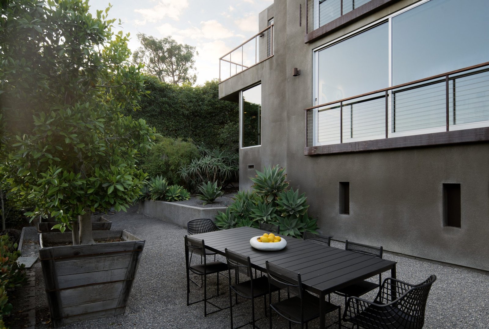 Outdoor patio dining at dusk, styled by S & S Interiors